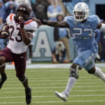 
              Virginia Tech running back Keshawn King, left, tries to evade North Carolina linebacker Power Echols during the first half of an NCAA college football game in Chapel Hill, N.C., Saturday, Oct. 1, 2022. (AP Photo/Chris Seward)
            