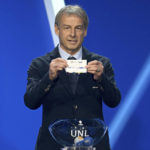 
              Juergen Klinsmann, former soccer player and soccer official, holds the lot of The Netherlands during the draw for the groups to qualify for the 2024 European soccer championship in Frankfurt, Germany, Sunday, Oct.9, 2022.  (Arne Dedert/dpa via AP)
            