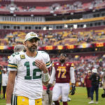 
              Green Bay Packers quarterback Aaron Rodgers walks off the field after an NFL football game against the Washington Commanders, Sunday, Oct. 23, 2022, in Landover, Md. The Commanders won 23-21. (AP Photo/Patrick Semansky)
            