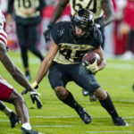 
              Purdue running back Devin Mockobee (45) cuts away from Nebraska defensive back Quinton Newsome (6) during the first half of an NCAA college football game in West Lafayette, Ind., Saturday, Oct. 15, 2022. (AP Photo/Michael Conroy)
            