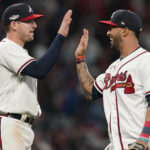 
              Atlanta Braves Austin Riley, left, and Atlanta Braves Eddie Rosario celebrate a win during the ninth inning in Game 2 of baseball's National League Division Series, Wednesday, Oct. 12, 2022, in Atlanta. The Atlanta Braves won 3-0.(AP Photo/Brynn Anderson)
            