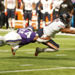 
              Chicago Bears quarterback Justin Fields (1) is tackled by Minnesota Vikings linebacker Eric Kendricks (54) during the second half of an NFL football game, Sunday, Oct. 9, 2022, in Minneapolis. (AP Photo/Bruce Kluckhohn)
            