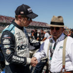 
              Brad Keselowski, left, talks with Jack Rousch before a NASCAR Cup Series auto race Sunday, Oct. 2, 2022, in Talladega, Ala. (AP Photo/Butch Dill)
            