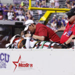 
              Oklahoma defensive back Damond Harmon (17) is tended to by team staff after a collision on a play against TCU during the second half of an NCAA college football game Saturday, Oct. 1, 2022, in Fort Worth, Texas. TCU won 55-24.(AP Photo/Ron Jenkins)
            