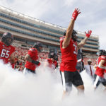 
              Texas Tech's Matthew Young (33) raises his arms while running onto the field before an NCAA college football game against West Virginia, Saturday, Oct. 22, 2022, in Lubbock, Texas. (AP Photo/Brad Tollefson)
            