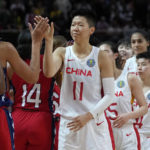 
              China's players, right, shake hands with the United States' players following their gold medal game at the women's Basketball World Cup in Sydney, Australia, Saturday, Oct. 1, 2022. (AP Photo/Rick Rycroft)
            