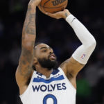 
              Minnesota Timberwolves guard D'Angelo Russell (0) attempts to shoot during the first half of an NBA basketball game against the San Antonio Spurs, Monday, Oct. 24, 2022, in Minneapolis. (AP Photo/Abbie Parr)
            