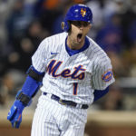 
              New York Mets Jeff McNeil (1) reacts as he heads up the first base line after hitting a two-run double against the San Diego Padres during the seventh inning of Game 2 of a National League wild-card baseball playoff series, Saturday, Oct. 8, 2022, in New York. (AP Photo/John Minchillo)
            