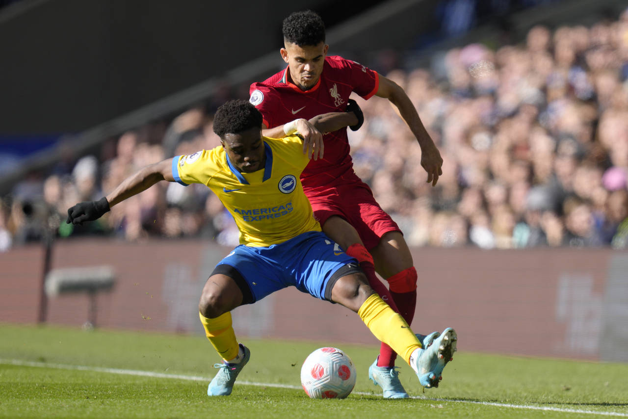 FILE - Liverpool's Luis Diaz, right, challenges for the ball with Brighton's Tariq Lamptey during t...