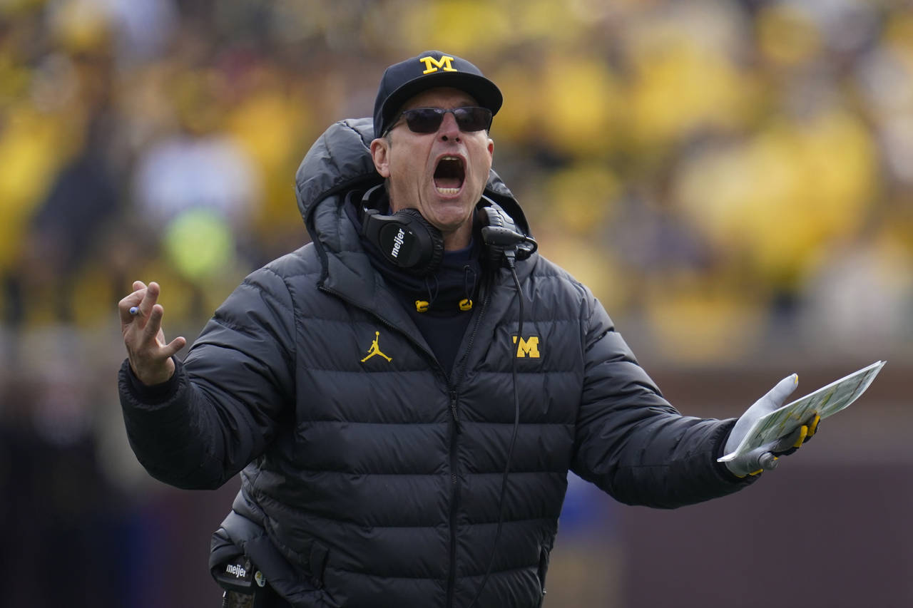 Michigan head coach Jim Harbaugh argues a call against Penn State in the second half of an NCAA col...