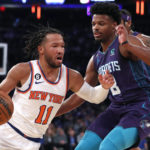 
              New York Knicks guard Jalen Brunson (11) drives to the basket against Charlotte Hornets guard Dennis Smith Jr. (8) during the first half of an NBA basketball game in New York. Wednesday, Oct. 26, 2022. (AP Photo/Noah K. Murray)
            