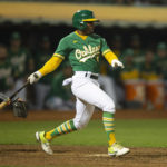 
              Oakland Athletics pinch hitter Tony Kemp (5) follows through on his game-winning single against the Los Angeles Angels during the tenth inning of a baseball game, Monday, Oct. 3, 2022, in Oakland, Calif. (AP Photo/D. Ross Cameron)
            