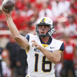 
              West Virginia's JT Daniels (18) passes the ball during the first half of an NCAA college football game against Texas Tech, Saturday, Oct. 22, 2022, in Lubbock, Texas. (AP Photo/Brad Tollefson)
            