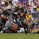 
              Tennessee running back Jabari Small (2) carries for a long gain in the first half of an NCAA college football game against LSU in Baton Rouge, La., Saturday, Oct. 8, 2022. (AP Photo/Gerald Herbert)
            