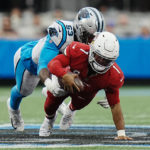 
              Arizona Cardinals quarterback Kyler Murray is tackled by Carolina Panthers defensive end Brian Burns during the first half of an NFL football game on Sunday, Oct. 2, 2022, in Charlotte, N.C. (AP Photo/Rusty Jones)
            