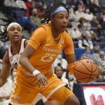 
              FILE - Tennessee's Jordan Horston (25) drives past Connecticut's Christyn Williams in the first half of an NCAA college basketball game Feb. 6, 2022, in Hartford, Conn. Horston missed the final 15 games for Tennessee due to injury last season after leading them to an 18-1 start. (AP Photo/Jessica Hill, File)
            