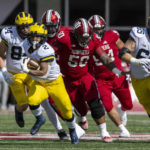 
              Michigan running back Blake Corum (2) runs the ball out of the backfield during the first half of an NCAA college football game against Indiana, Saturday, Oct. 8, 2022, in Bloomington, Ind. (AP Photo/Doug McSchooler)
            