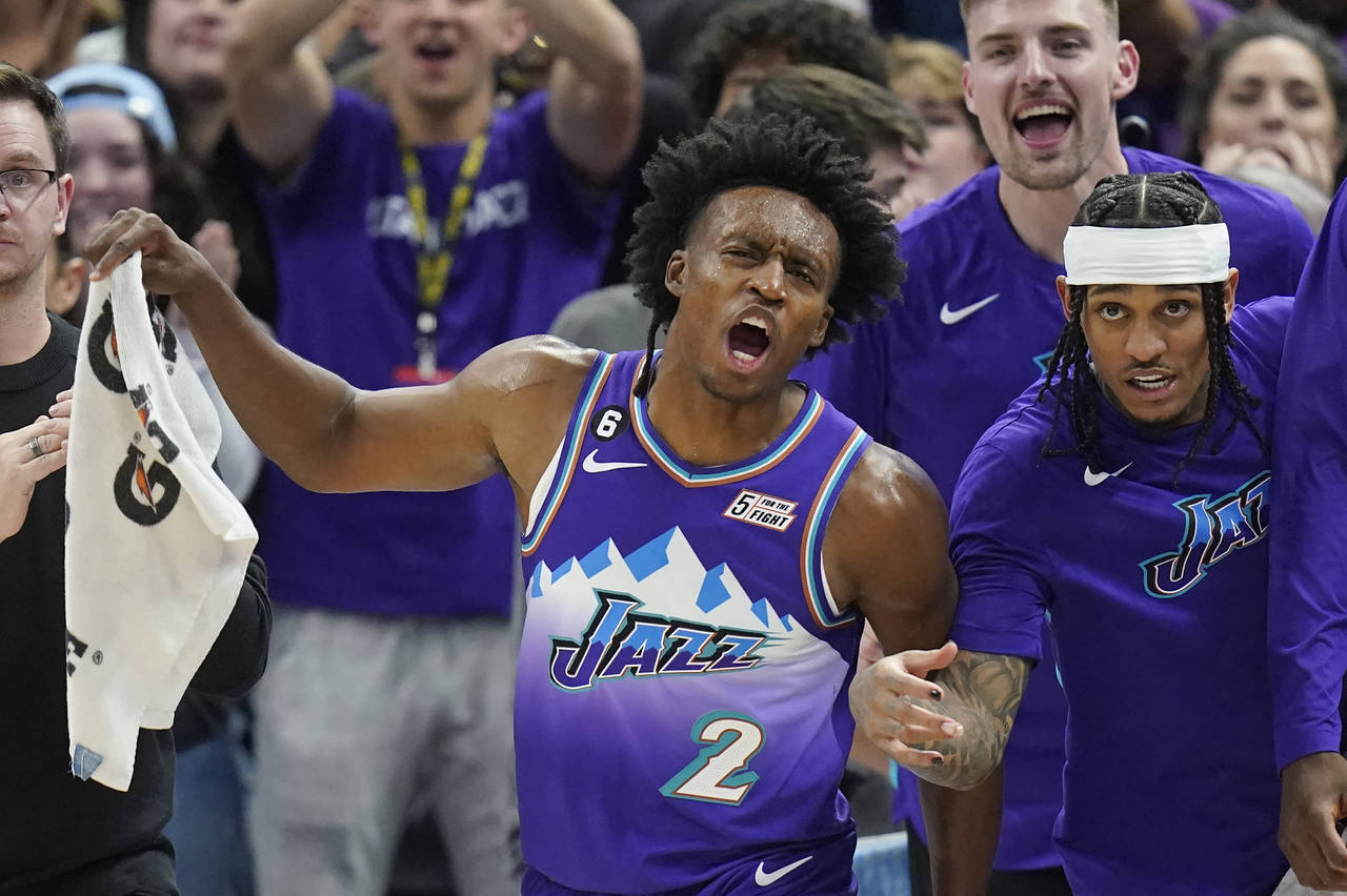 Utah Jazz's Collin Sexton (2) and Jordan Clarkson, right, react at the end of the team's NBA basket...
