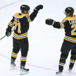 
              Boston Bruins left wing Taylor Hall (71) celebrates with defenseman Hampus Lindholm (27) after Hall scored during the second period of the team's NHL hockey game against the Anaheim Ducks, Thursday, Oct. 20, 2022, in Boston. (AP Photo//Steven Senne)
            