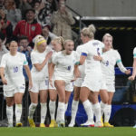 
              England's Georgia Stanway, centre, celebrates after scoring her side's second goal during the women's friendly soccer match between England and the US at Wembley stadium in London, Friday, Oct. 7, 2022. (AP Photo/Kirsty Wigglesworth)
            