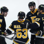 
              Boston Bruins left wing Brad Marchand (63) is congratulated after his goal during the second period of an NHL hockey game against the Detroit Red Wings, Thursday, Oct. 27, 2022, in Boston. Marchand, who underwent offseason double-hip surgery that was supposed to keep him out until the end of November, started the game. (AP Photo/Charles Krupa)
            