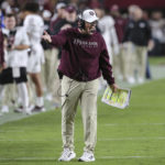
              Texas A&M coach Jimbo Fisher gestures during the first half of the team's NCAA college football game against South Carolina on Saturday, Oct. 22, 2022, in Columbia, S.C. (AP Photo/Artie Walker Jr.)
            