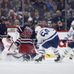
              Toronto Maple Leafs' David Kampf (64) scores on Winnipeg Jets goaltender Connor Hellebuyck during the second period of an NHL hockey game Saturday, Oct. 22, 2022, in Winnipeg, Manitoba. (John Woods/The Canadian Press via AP)
            