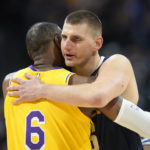 
              Denver Nuggets center Nikola Jokic, right, hugs Los Angeles Lakers forward LeBron James (6) in the first half of an NBA basketball game Wednesday, Oct. 26, 2022, in Denver. (AP Photo/David Zalubowski)
            