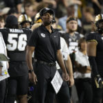 
              Colorado head coach Karl Dorrell, center, looks on in the second half of an NCAA college football game against TCU Friday, Sept. 2, 2022, in Boulder, Colo. (AP Photo/David Zalubowski)
            