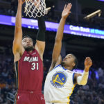 
              Miami Heat guard Max Strus (31) shoots against Golden State Warriors guard Moses Moody (4) during the first half of an NBA basketball game in San Francisco, Thursday, Oct. 27, 2022. (AP Photo/Jeff Chiu)
            