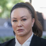 
              Alana Gee, the widow of a former University of Southern California football player suing the NCAA for failing to protect her husband from repetitive head trauma, leaves the Stanley Mosk civil courthouse of Los Angeles Superior Court on Friday, Oct. 21, 2022. Matthew Gee died in 2018 from permanent brain damage caused by countless blows to the head he took while playing linebacker for the 1990 Rose Bowl winning team, according to the wrongful death suit filed by Alana Gee. (AP Photo/Ringo H.W. Chiu)
            