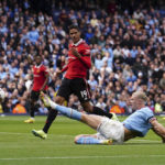 
              Manchester City's Erling Haaland scores his side's third goal during the English Premier League soccer match between Manchester City and Manchester United at Etihad stadium in Manchester, England, Sunday, Oct. 2, 2022. (Martin Rickett/PA via AP)
            