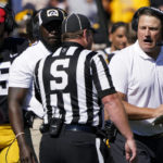 
              Iowa offensive coordinator Brian Ferentz, right, questions a call during the second half of an NCAA college football game against Michigan, Saturday, Oct. 1, 2022, in Iowa City, Iowa. Michigan won 27-14. (AP Photo/Charlie Neibergall)
            