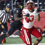 
              Rutgers defensive back Kessawn Abraham, left, watches Nebraska wide receiver Trey Palmer (3) catch a pass for a touchdown during the fourth quarter of an NCAA college football game Friday, Oct. 7, 2022, in Piscataway, N.J. (Andrew Mills/NJ Advance Media via AP)
            