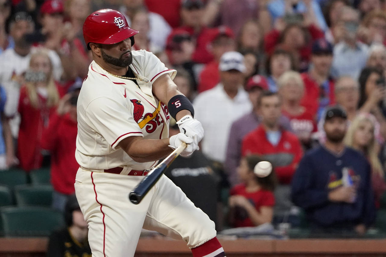 St. Louis Cardinals' Albert Pujols hits a two-run single during the first inning of a baseball game...