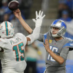 
              Detroit Lions quarterback Jared Goff (16) is pressured by Miami Dolphins linebacker Jaelan Phillips (15) during the second half of an NFL football game, Sunday, Oct. 30, 2022, in Detroit. (AP Photo/Paul Sancya)
            