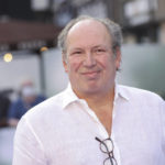 
              FILE - Hans Zimmer poses for photographers upon arrival for the screening of the film 'Thirteen Lives' in London, Monday, July 18, 2022. When the Seattle Kraken decided to revamp the thematic elements of their pregame introduction during the offseason, Hollywood filmmaker Jerry Bruckheimer, part of the Kraken ownership group,  said he had a friend who might be willing to do a favor and provide a grandiose soundtrack of music building to a crescendo as the players hit the ice and would accompany the video production. That friend: Grammy and Oscar Award winning composer Hans Zimmer. (Photo by Vianney Le Caer/Invision/AP, File)
            