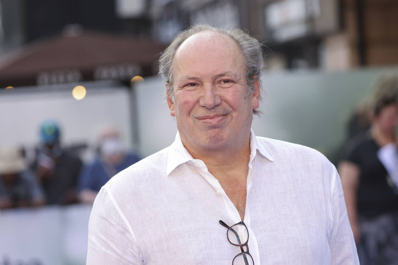 FILE - Hans Zimmer poses for photographers upon arrival for the screening of the film 'Thirteen Liv...