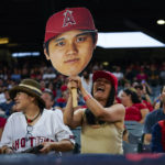 
              A fan holds up a cutout of the head of Los Angeles Angels designated hitter Shohei Ohtani (17) during a baseball game against the Oakland Athletics in Anaheim, Calif., Tuesday, Sept. 27, 2022. (AP Photo/Ashley Landis)
            