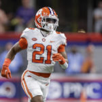
              FILE - Clemson's Malcolm Greene runs on the field during the first half of the team's NCAA football game against Georgia Tech on Sept. 5, 2022, in Atlanta. Clemson defensive backs Greene and Fred Davis II are being sued by a U.S. postal worker whose car Davis collided with last year. The suit was filed Wednesday, Oct. 5, in Pickens County Common Pleas Court in South Carolina, a form of civil court. (AP Photo/Stew Milne, File)
            