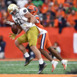 
              Notre Dame tight end Michael Mayer, left, has a pass broken up by Syracuse defensive back Jason Simmons Jr. during the first half of an NCAA college football game in Syracuse, N.Y., Saturday, Oct. 29, 2022. (AP Photo/Adrian Kraus)
            