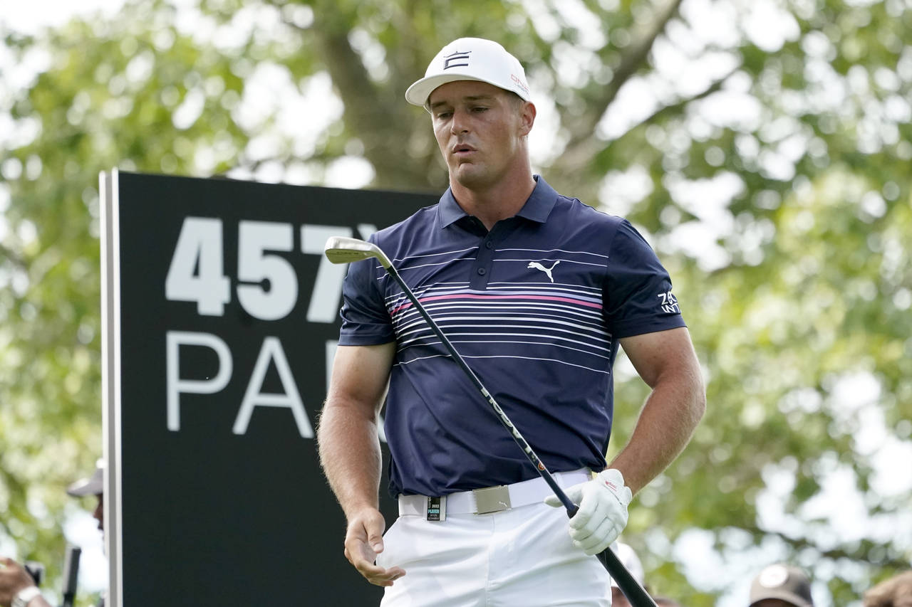 Bryson DeChambeau looks at his club after hitting his tee shot on the fourth hole during the final ...