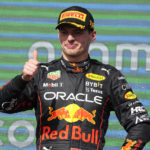 
              Red Bull driver Max Verstappen, of the Netherlands, celebrates on the podium after winning the Formula One U.S. Grand Prix auto race at Circuit of the Americas, Sunday, Oct. 23, 2022, in Austin, Texas. (AP Photo/Charlie Neibergall)
            