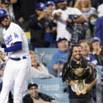 
              A goose takes flight past Los Angeles Dodgers' Cody Bellinger, left, during the eighth inning in Game 2 of the baseball team's NL Division Series against the San Diego Padres, Wednesday, Oct. 12, 2022, in Los Angeles. (AP Photo/Ashley Landis)
            