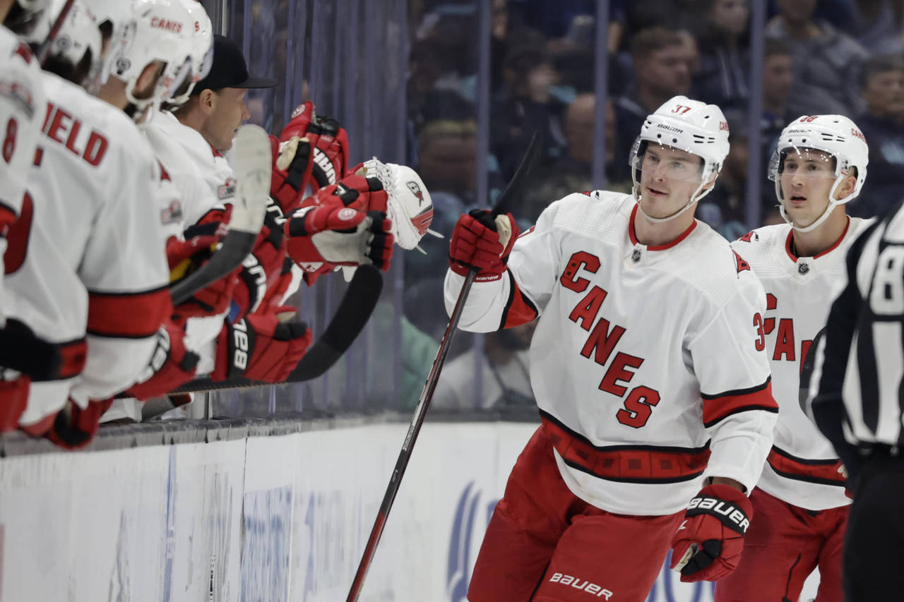 Carolina Hurricanes right wing Andrei Svechnikov (37) is congratulated by the bench after scoring a...