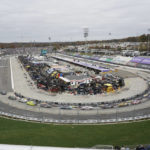 
              Drivers take their cars around the track during a NASCAR Cup Series auto race at Martinsville Speedway, Sunday, Oct. 30, 2022, in Martinsville, Va. (AP Photo/Chuck Burton)
            