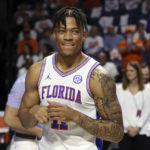 
              FILE - Florida forward Keyontae Johnson (11) smiles after being introduced as a starter before the first half of an NCAA college basketball game against Kentucky, on March 5, 2022, in Gainesville, Fla. Johnson was the Southeastern Conference’s preseason player of the year in 2020-21 but collapsed during a game in December 2020 and hasn’t played since. This season marks his comeback with a new team.  (AP Photo/Matt Stamey, File)
            