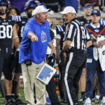 
              Duke head coach Mike Elko, center left, protests a call during the first half of an NCAA college football game against North Carolina in Durham, N.C., Saturday, Oct. 15, 2022. (AP Photo/Ben McKeown)
            
