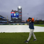 
              Houston Astros left fielder Chas McCormick walks in the field before Game 3 of baseball's World Series between the Houston Astros and the Philadelphia Phillies on Monday, Oct. 31, 2022, in Philadelphia. The game was postponed by rain Monday night with the matchup tied 1-1. (AP Photo/David J. Phillip)
            