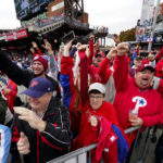
              Fans cheer before Game 5 of the baseball NL Championship Series between the San Diego Padres and the Philadelphia Phillies on Sunday, Oct. 23, 2022, in Philadelphia. (AP Photo/Matt Rourke)
            